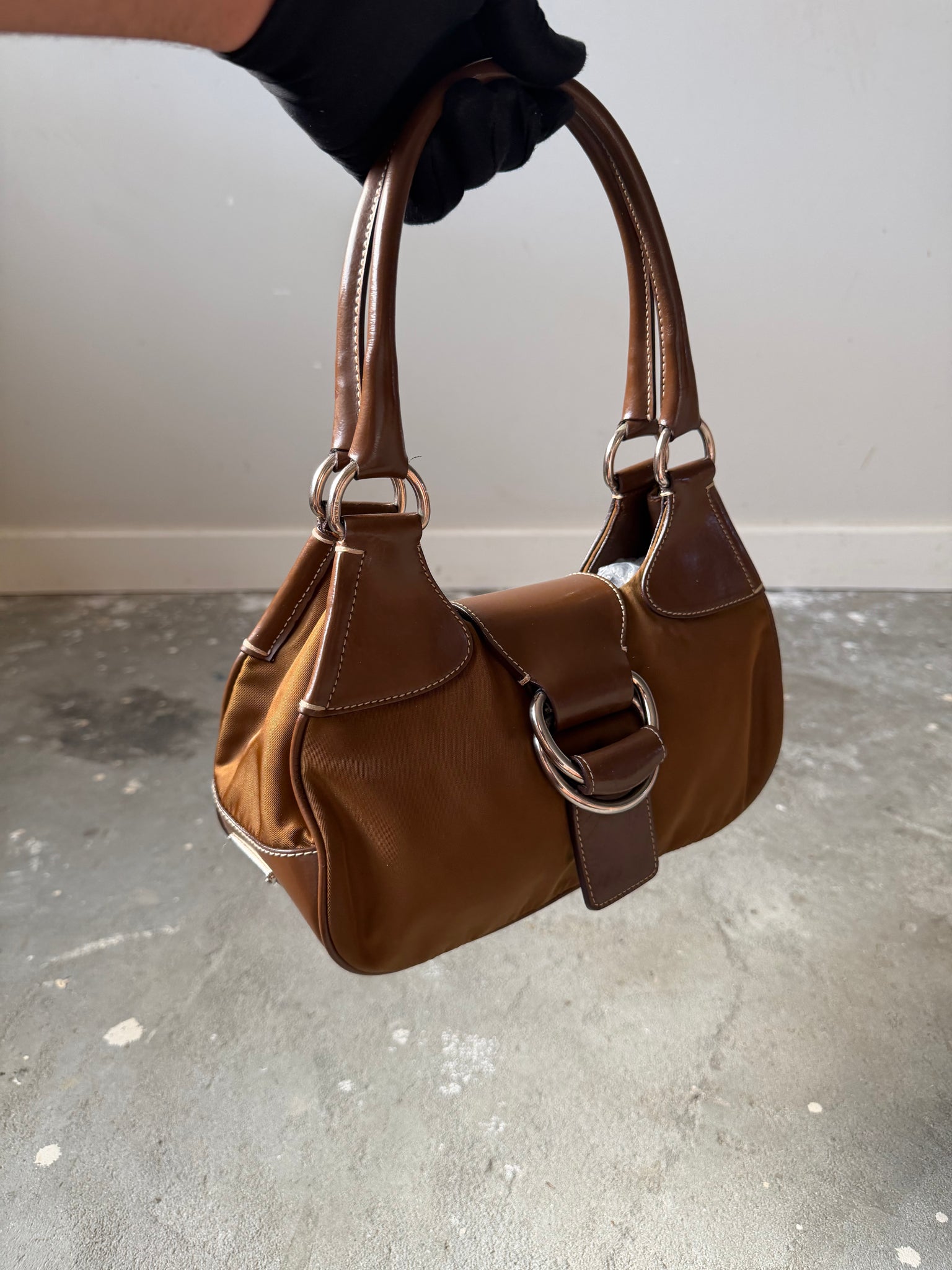 Prada Enamelled Moon Shoulder Bag Brown